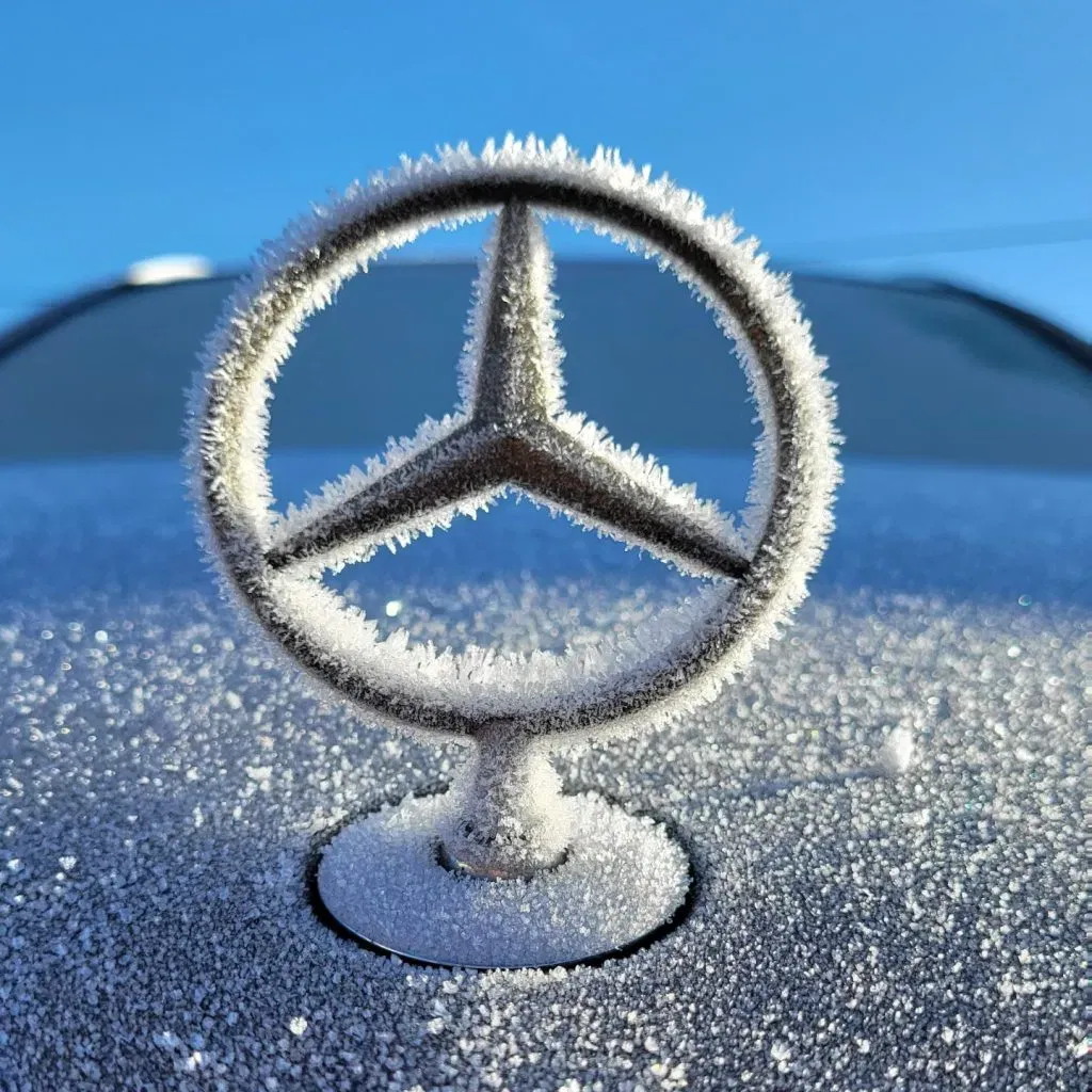 Mercedes-Benz emblem in winter frost
